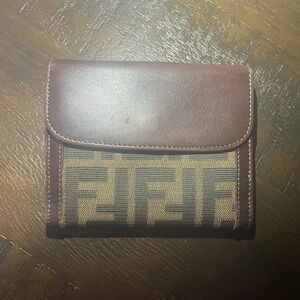 Great used condition Fendi Zucca wallet. Crossed posted